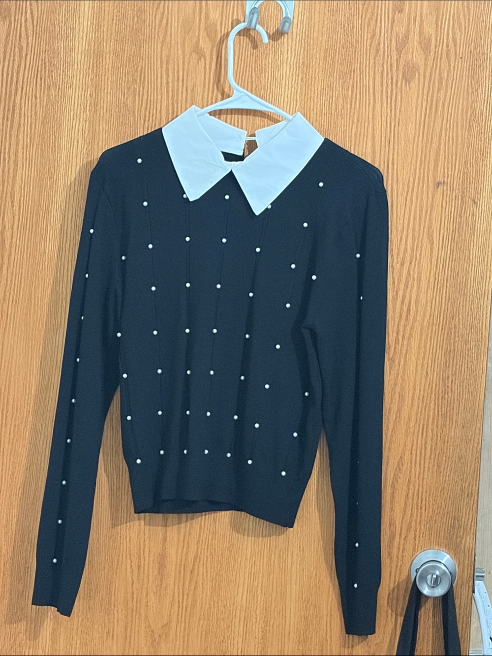 Black Pearl-Studded Sweater with White Contrast Collar